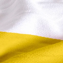 Couverture plaid 100% coton jaune avec pompons 130x170cm SLAVANN - SACASA