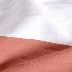 Couverture plaid 100% coton rose saumon avec pompons 130x170cm SLAVANN - SACASA