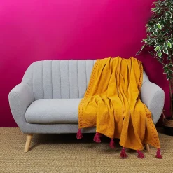 Jeté de canapé surpiqué pompons jaune 130x150 cm