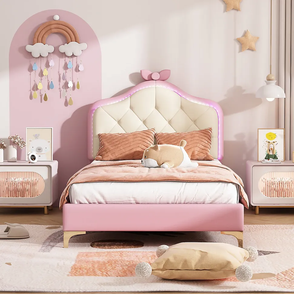 Lit enfant simple 90x200 cm rembourré avec bande LED colorée, tête ondulée et nœud décoratif, similicuir rose sans matelas