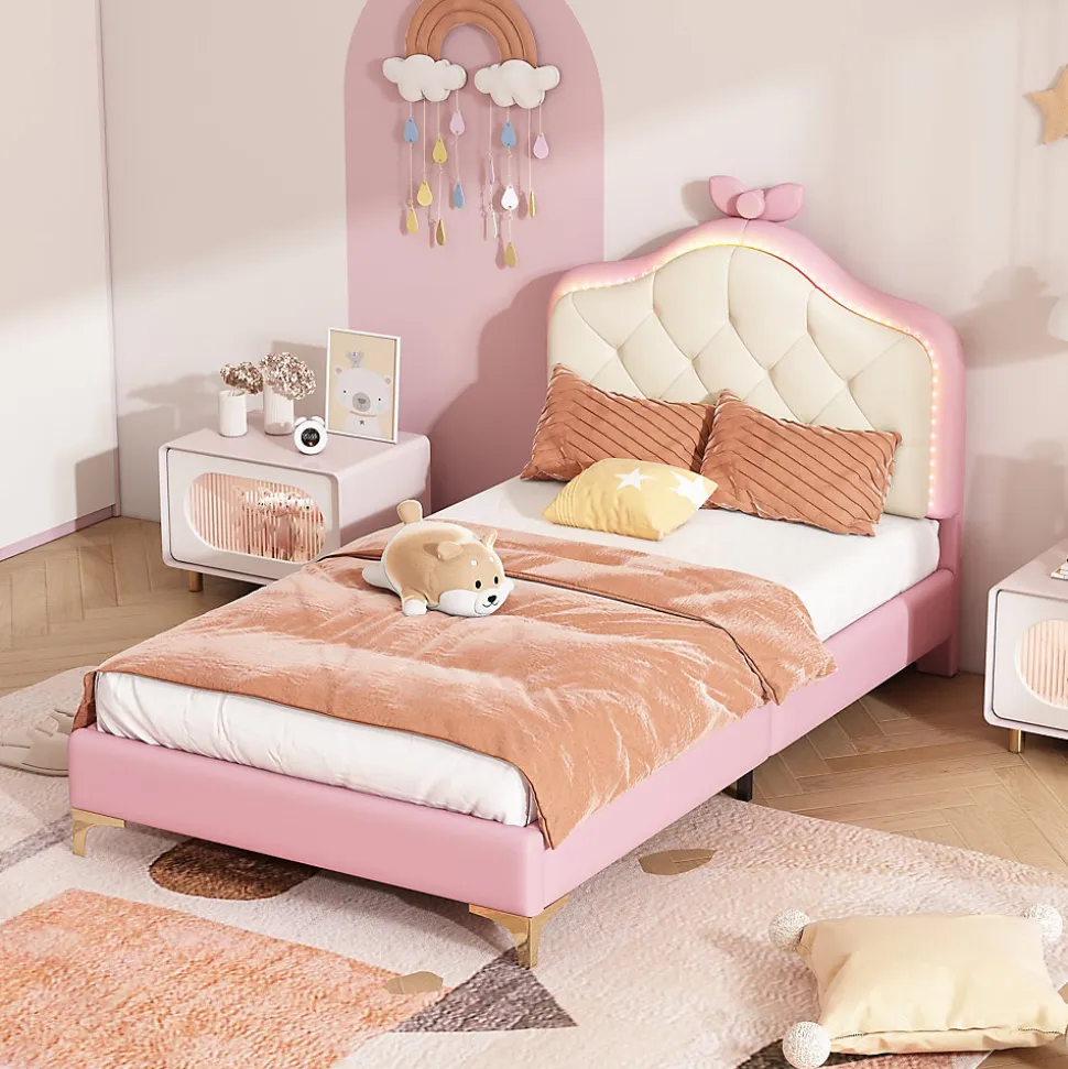 Lit enfant simple 90x200 cm rembourré avec bande LED colorée, tête ondulée et nœud décoratif, similicuir rose sans matelas