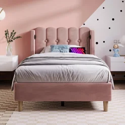 Lit 90x200 cm avec tête de lit à panneaux, tapissé velours rose et station de charge USB-C intégrée