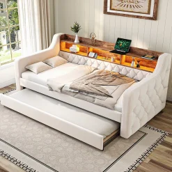 Lit 90x190 cm en velours beige avec rangement intégré, au design moderne et gain de place idéal pour studio