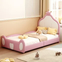 Lit 90x200 cm rembourré en simili cuir bicolore blanc et rose avec tête en forme de couronne, design enfant