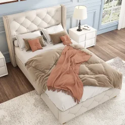 Lit 90x200 cm tapissé lin beige avec tête de lit capitonnée, clous décoratifs et pieds en bois renforcés